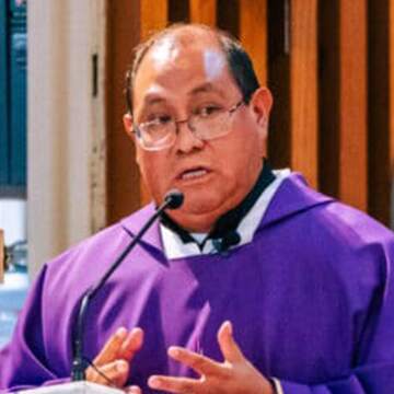 Padre Hilario giving a speech.